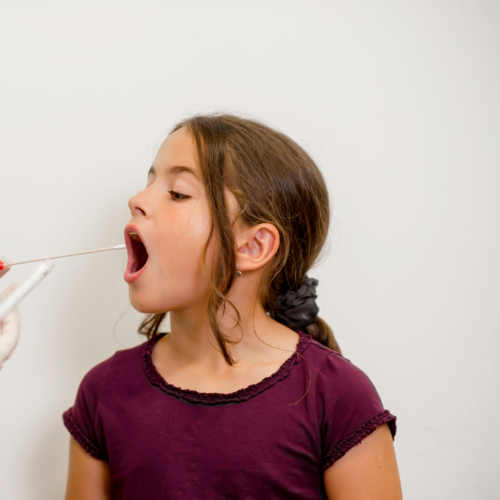 girl having mouth swab